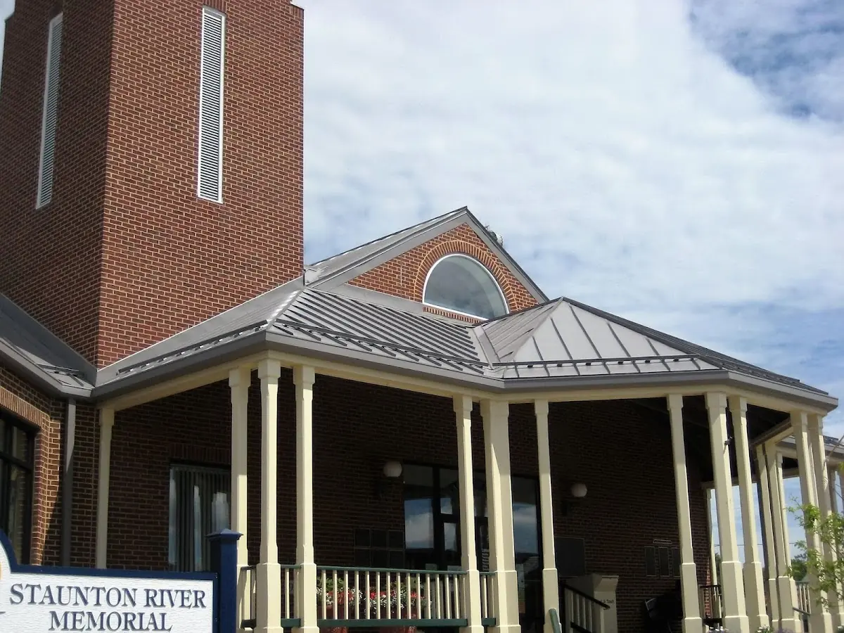 Skilled roofing craftsmen working on a residential roof in Portales
